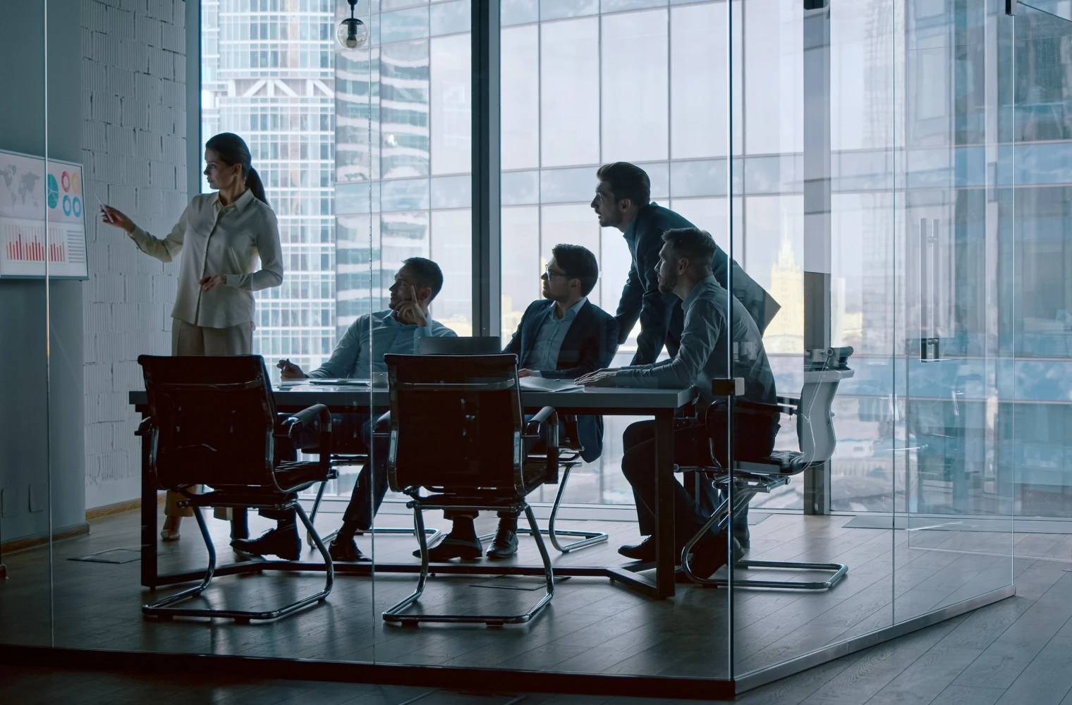 A team analyzing a digital globe and network